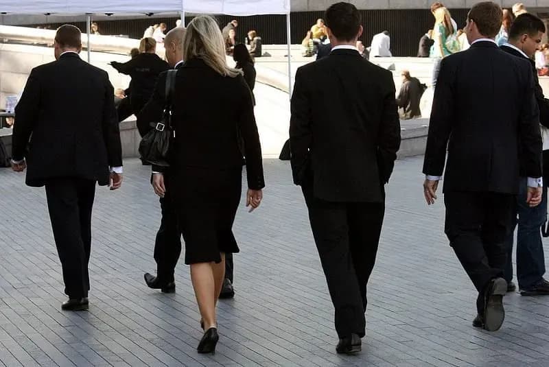 Suited-workers-on-the-go.webp